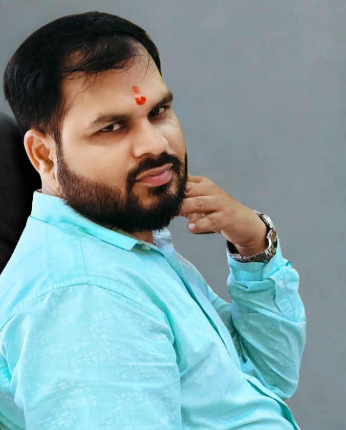 a boy in blue shirt, wearing wrist-watch looking confidently