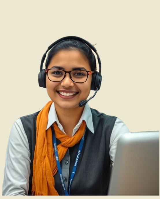 a girl in white shirt, black suit and saffron dupatta smiling with her laptop in front